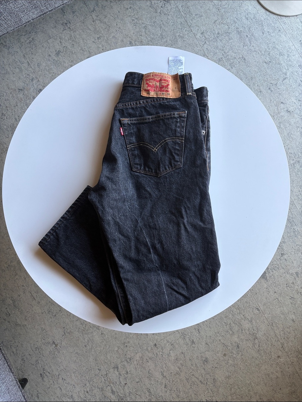 Straight-leg black denim from Levi's 501. 34 x 32. Fair Condition. Button front